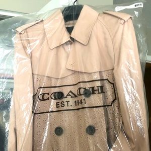 Eyelet trench . brand new. Never worn.